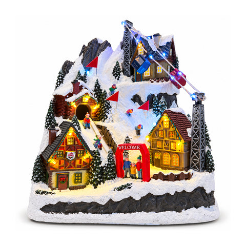 Illuminated Christmas Village with Moving Slide, Cable Car, LED Lights and Christmas Music – 28x19x32 cm